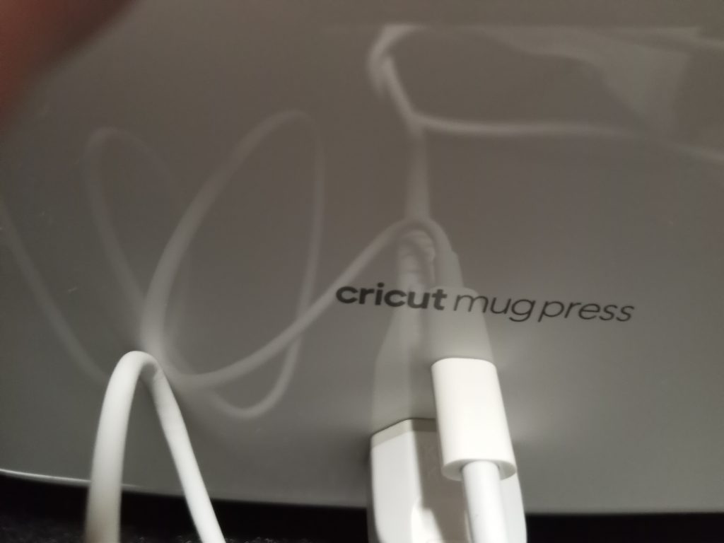 Plugging in USB cord Cricut Mug Press Setup