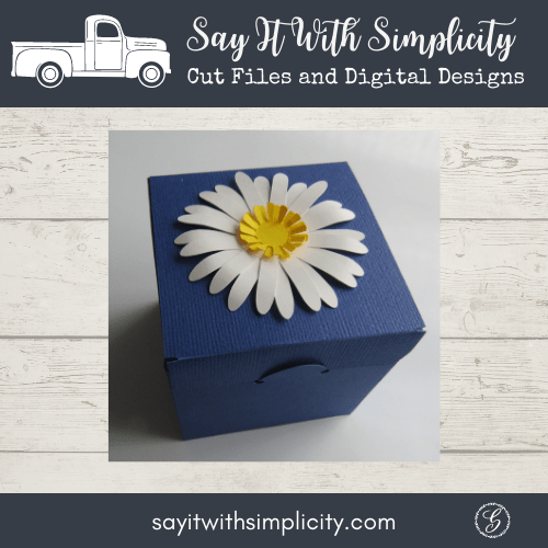 photo of box and 3D paper daisy