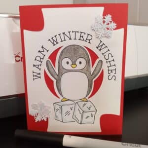 A2 insert card made in Cricut Design Space. Warm Winter Wishes card with drawing of penguin.