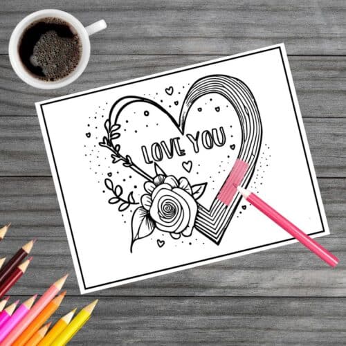 Coloring page freebie: A heart-shaped frame adorned with a delicate rose, encapsulating the words 'I Love You.