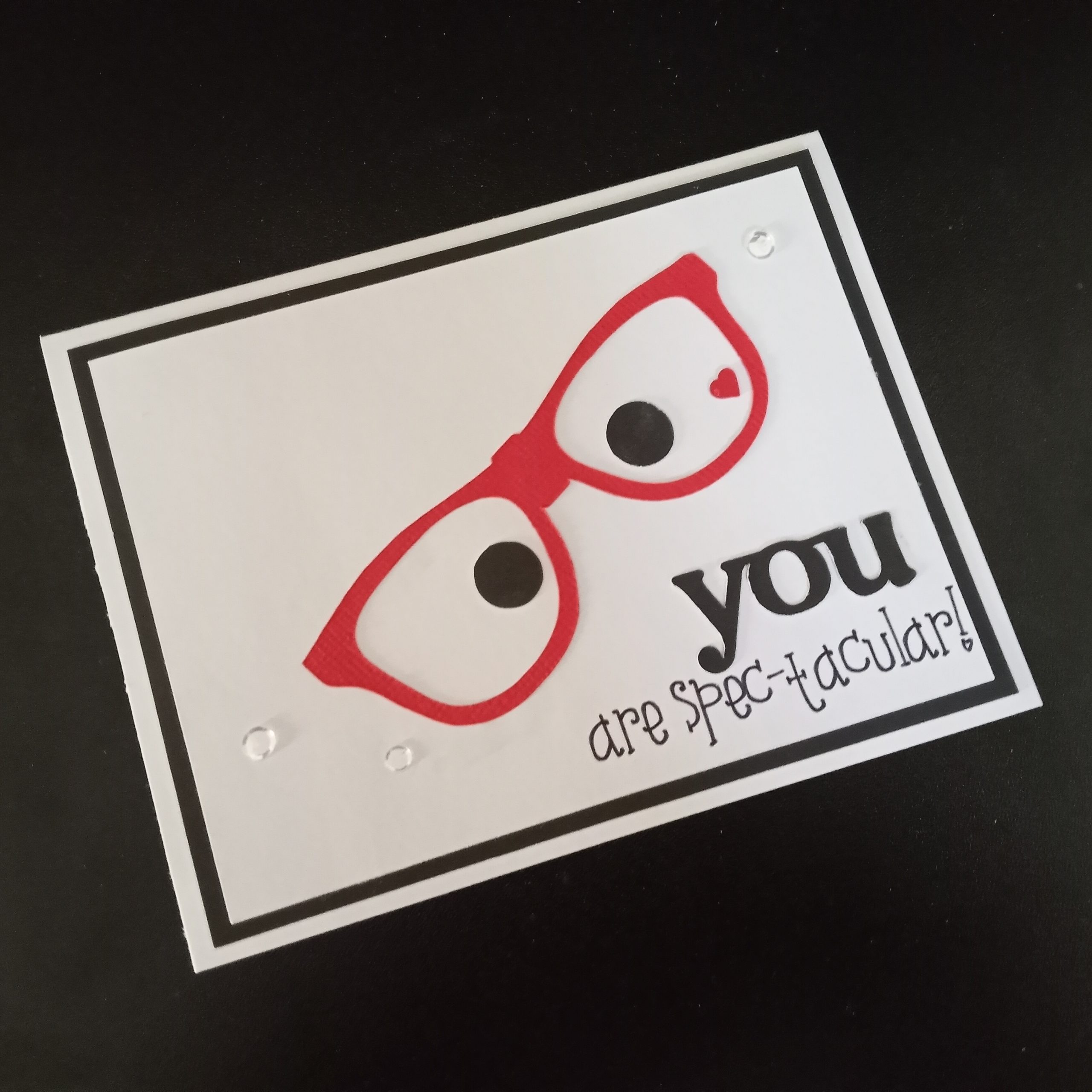 Picture of handmade card "You are spec-tacular" with red eye glasses.